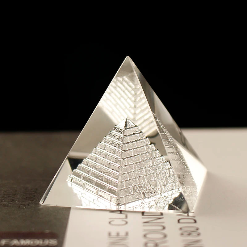 Pyramid-shaped object with reflective surface on a black background