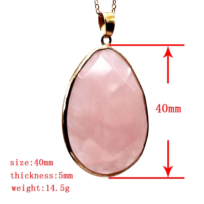 Pink teardrop pendant with gold frame and measurements on a white background