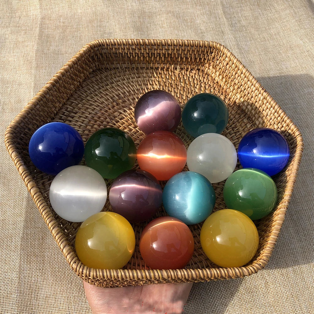 Wicker basket filled with colorful glass balls on a textured surface