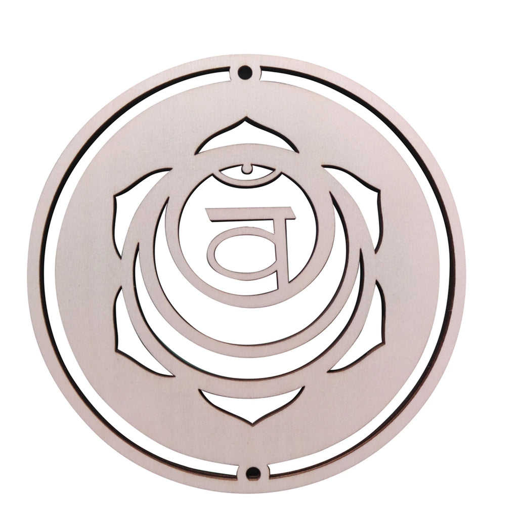 Decorative metal wall art with a circular design and central symbol on a white background