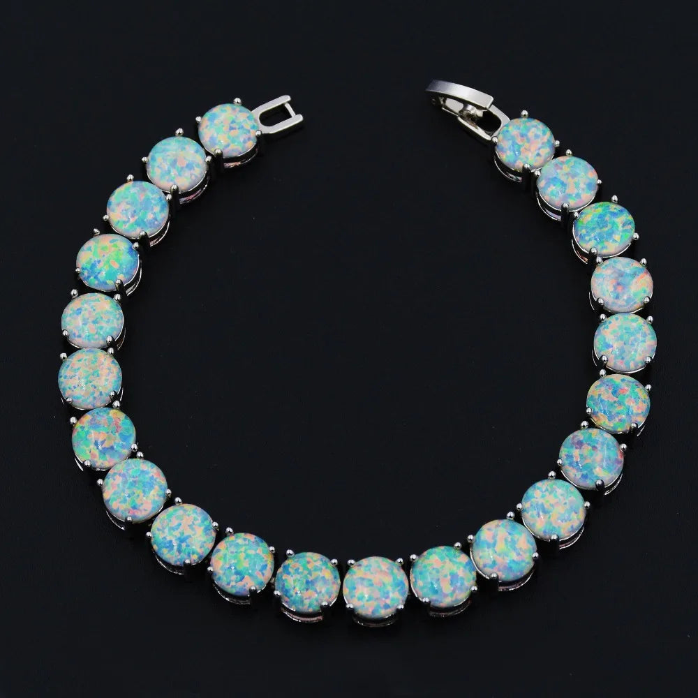 Opal bracelet with silver setting on a black background