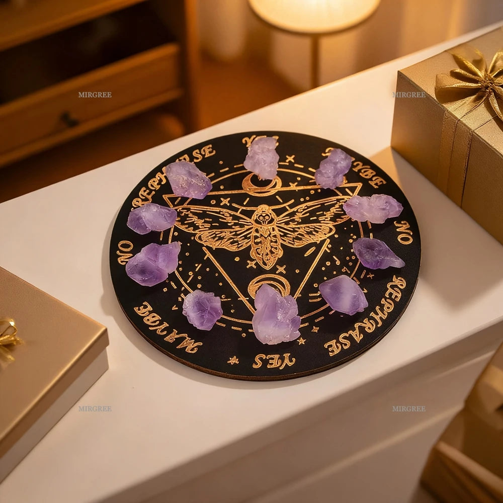 Black circular board with gold symbols and purple stones on a white surface