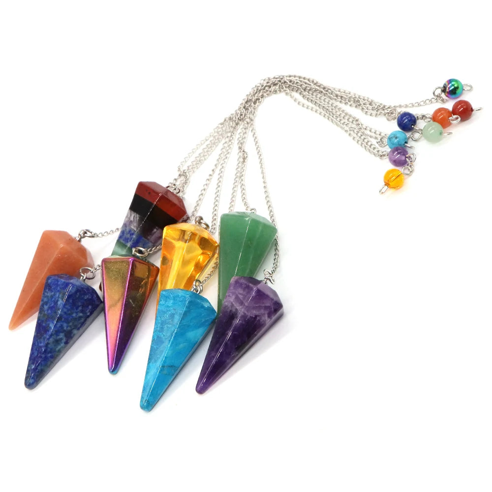 Colorful crystal pendulums on a white background