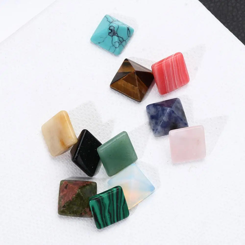 Collection of various colorful stones on a white surface