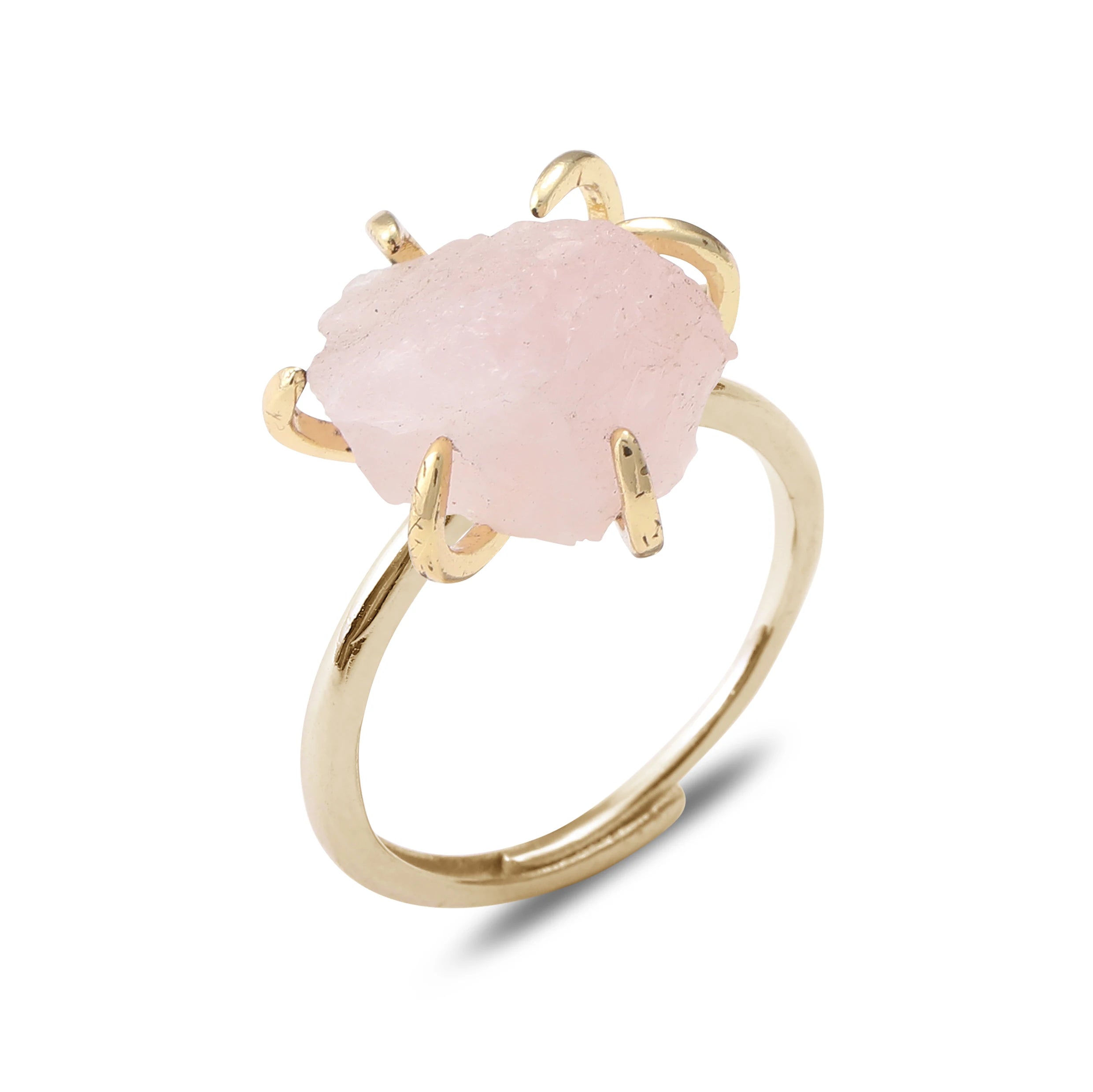 Gold ring with a pink stone on a white background