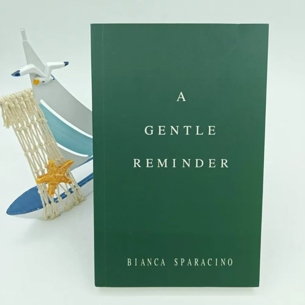 Book titled 'A Gentle Reminder' by Bianca Sparacino with a decorative item on a light background