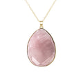 Pink teardrop pendant necklace on a white background
