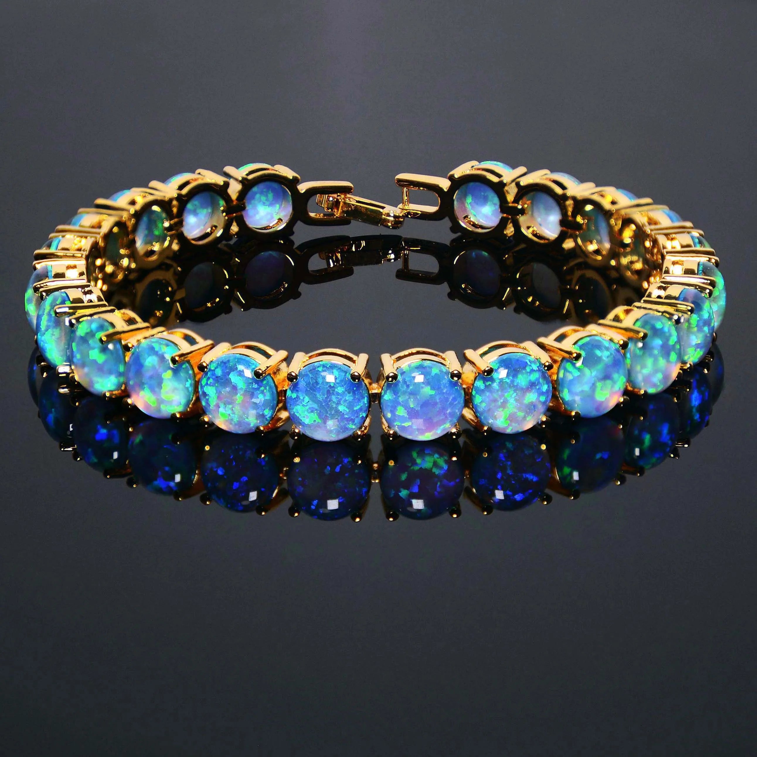 Gold bracelet with blue opal stones on a dark background