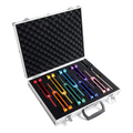Set of colorful tuning forks in an open metallic case on a white background