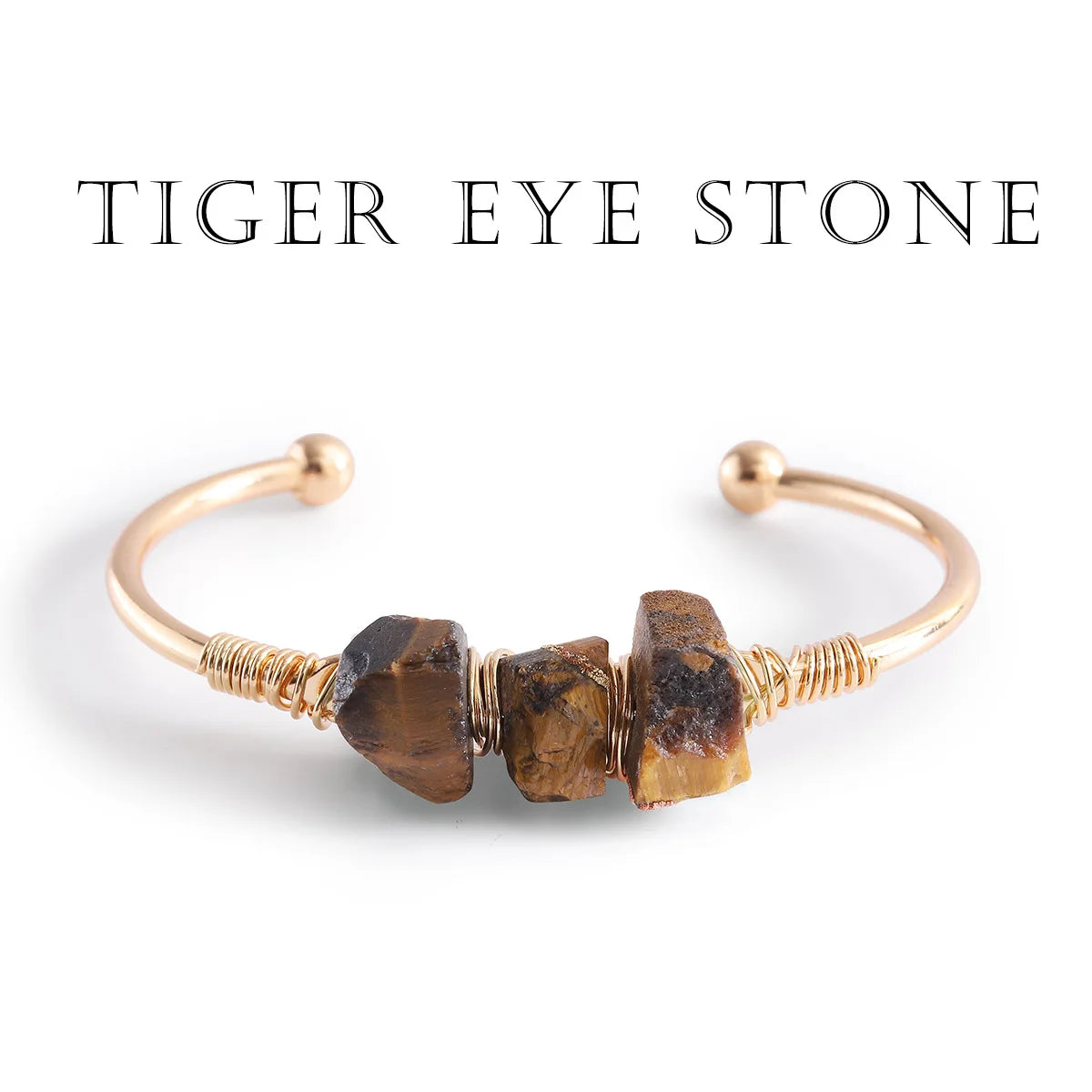 Gold bracelet with tiger eye stones on a white background