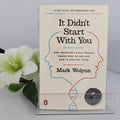 Book titled 'It Didn't Start With You' by Mark Wolynn with a flower in the background