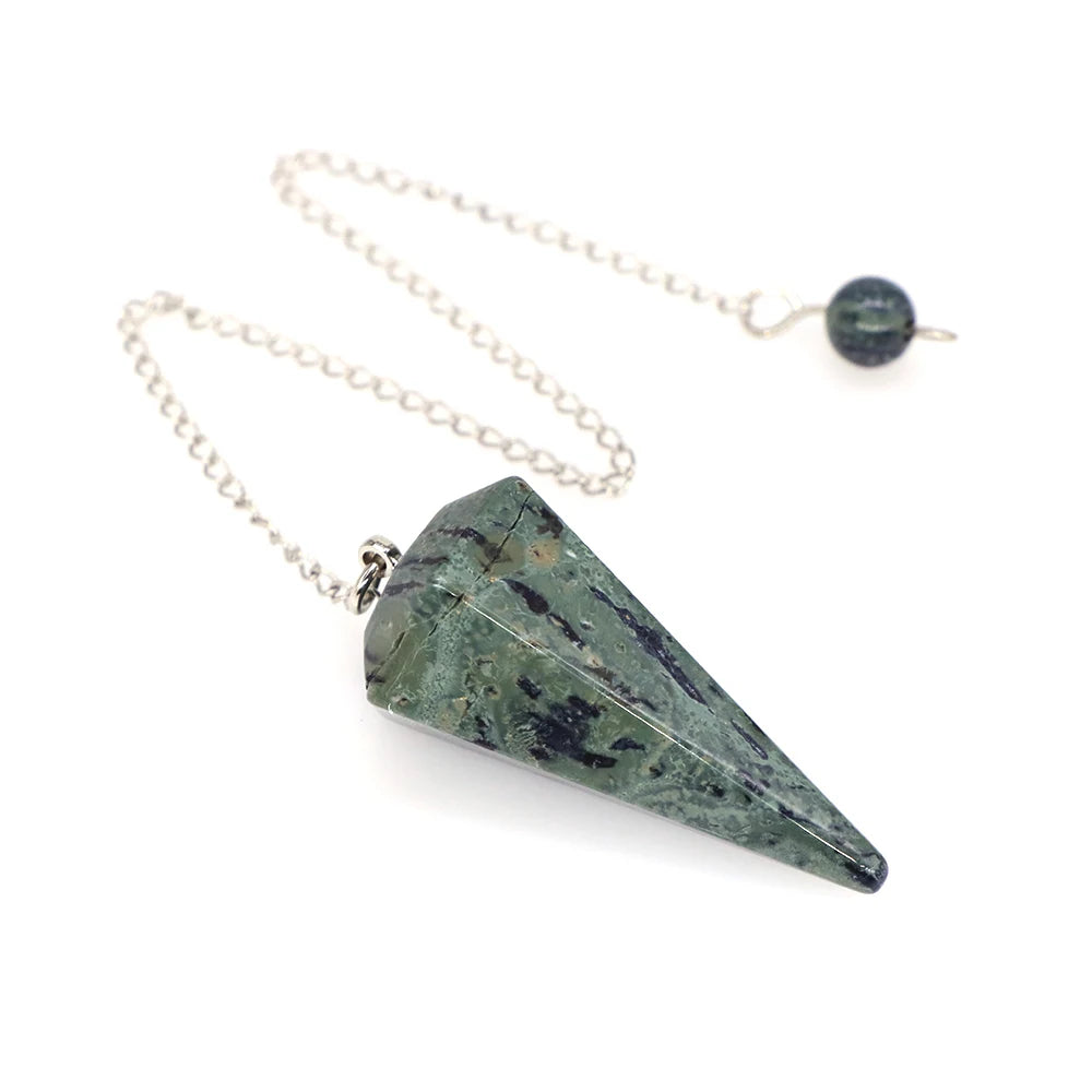 Green stone pendant on a chain against a white background