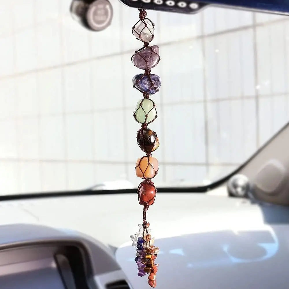 Colorful crystal car hanging accessory on a car's rearview mirror.
