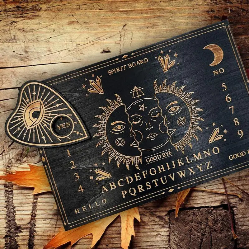 Wooden spirit board with sun and moon design on a rustic wooden surface