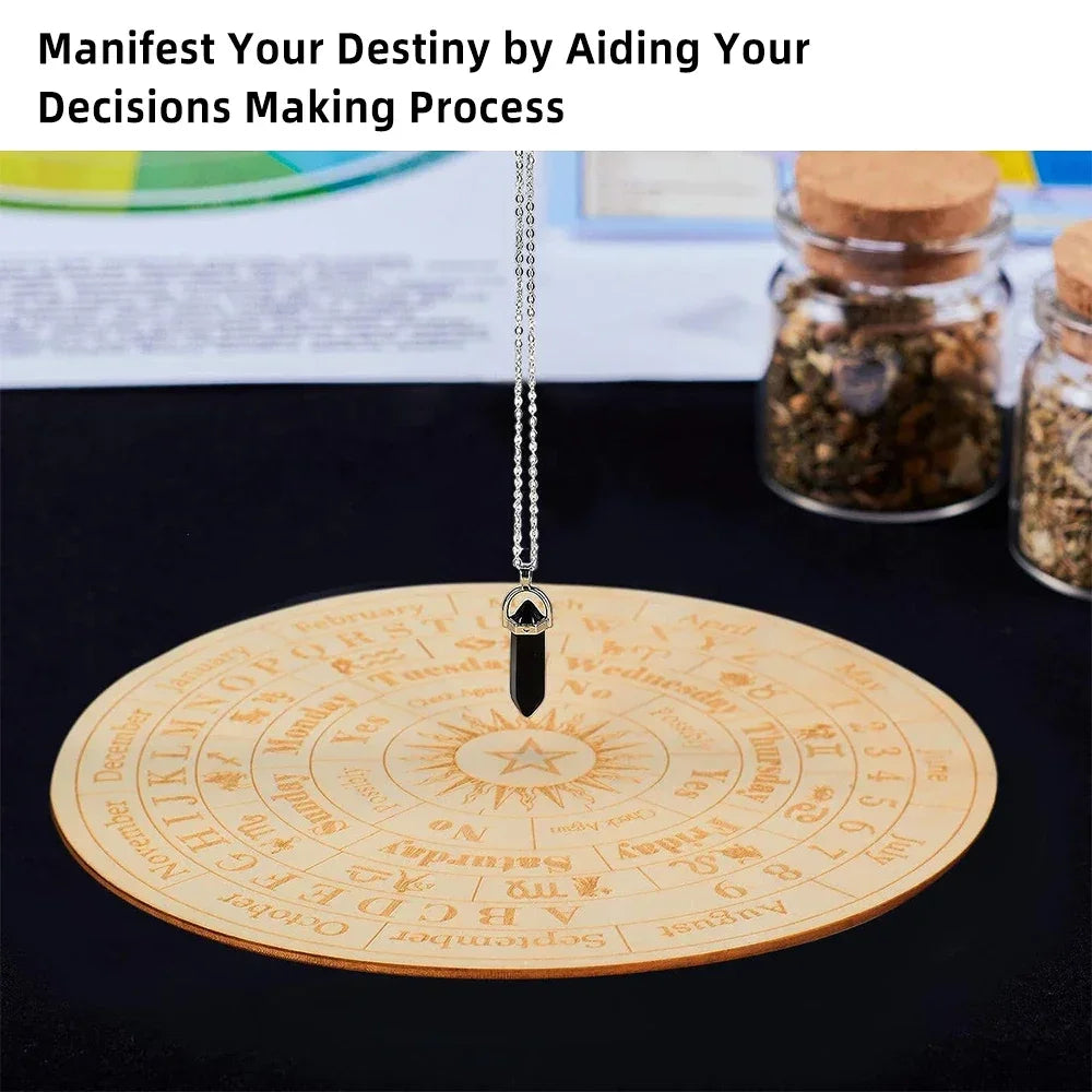 Decorative circular plate with engravings and a black pendant on a dark surface.