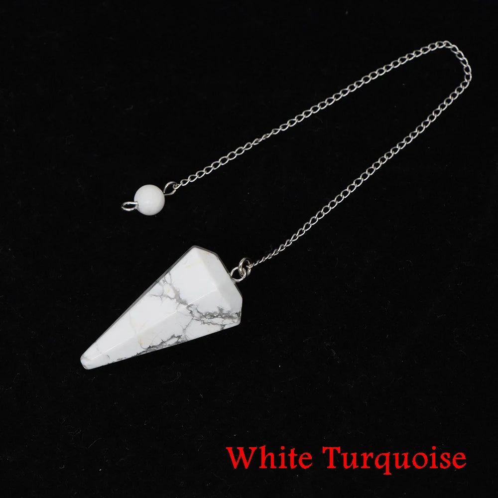 White turquoise stone pendant on a chain against a black background