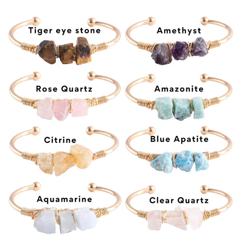 Set of gemstone bracelets with labels on a white background