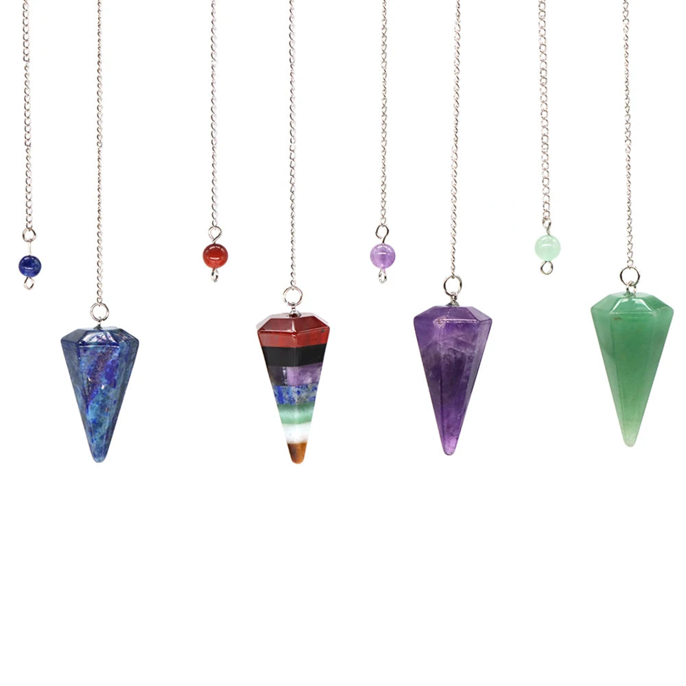 Set of crystal pendulums with colored beads on white background