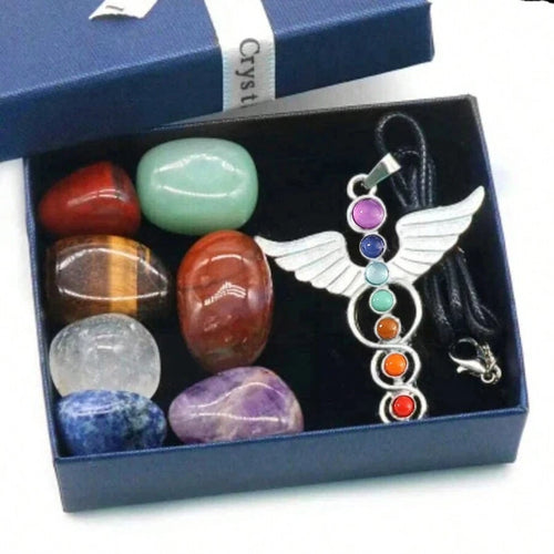 Set of chakra stones and a chakra pendant in a blue box
