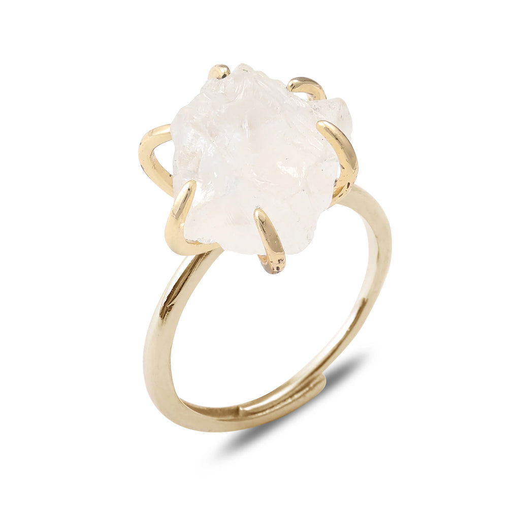 Gold ring with a large white stone on a white background