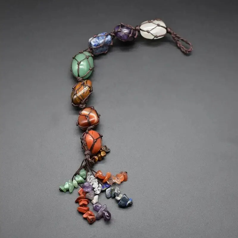 Multicolored beaded necklace on a gray background